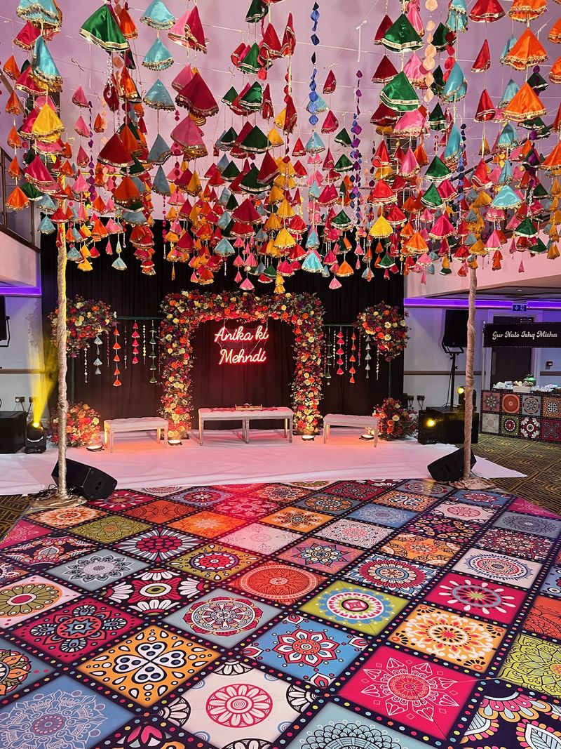 A ballroom dressed in pink with a floral canopy