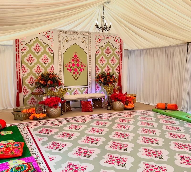 A printed backdrop with a swing and a patterned floor