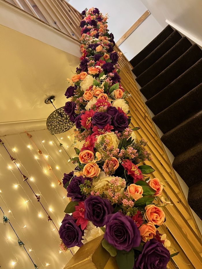 A staircase dressed with pink and white florals