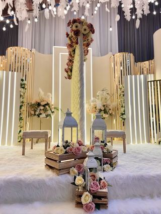 Ivory drapes with floor lanterns and a low sofa